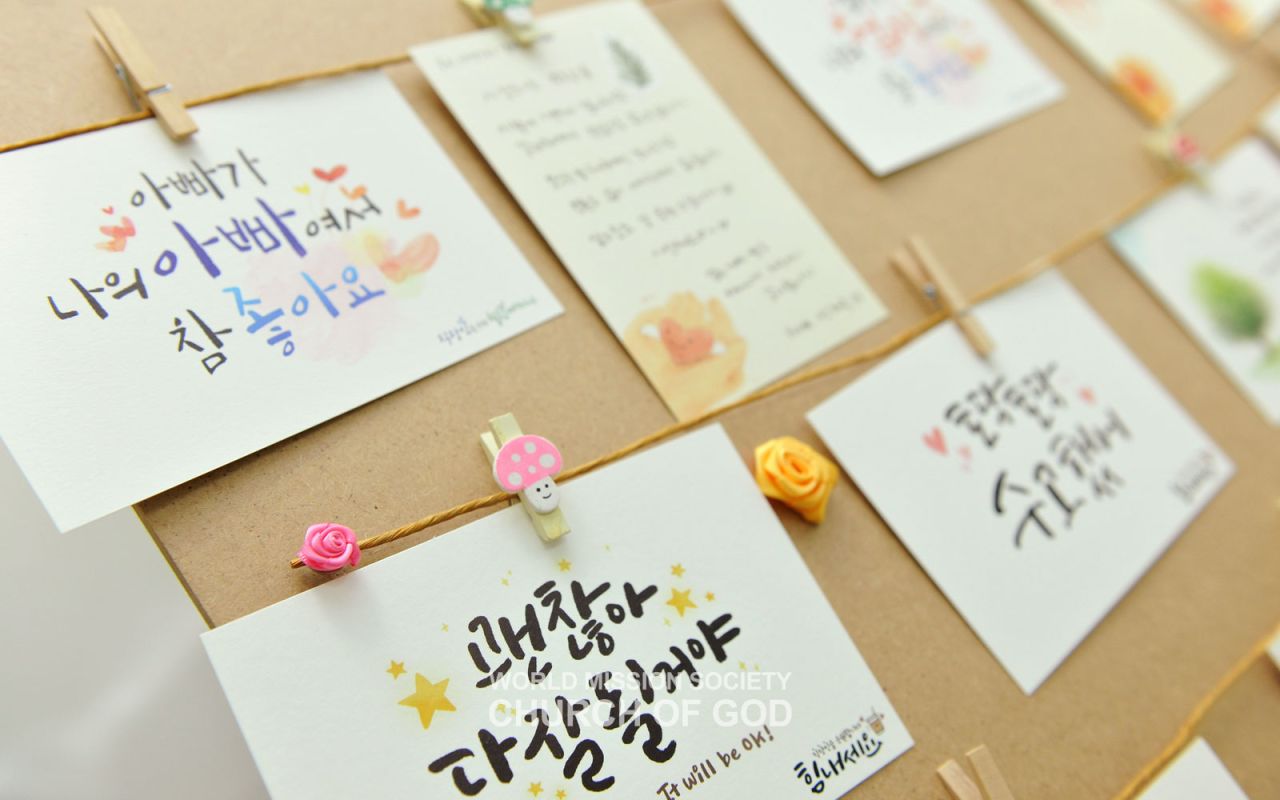 Calligraphy postcards made by young adult members at a side event