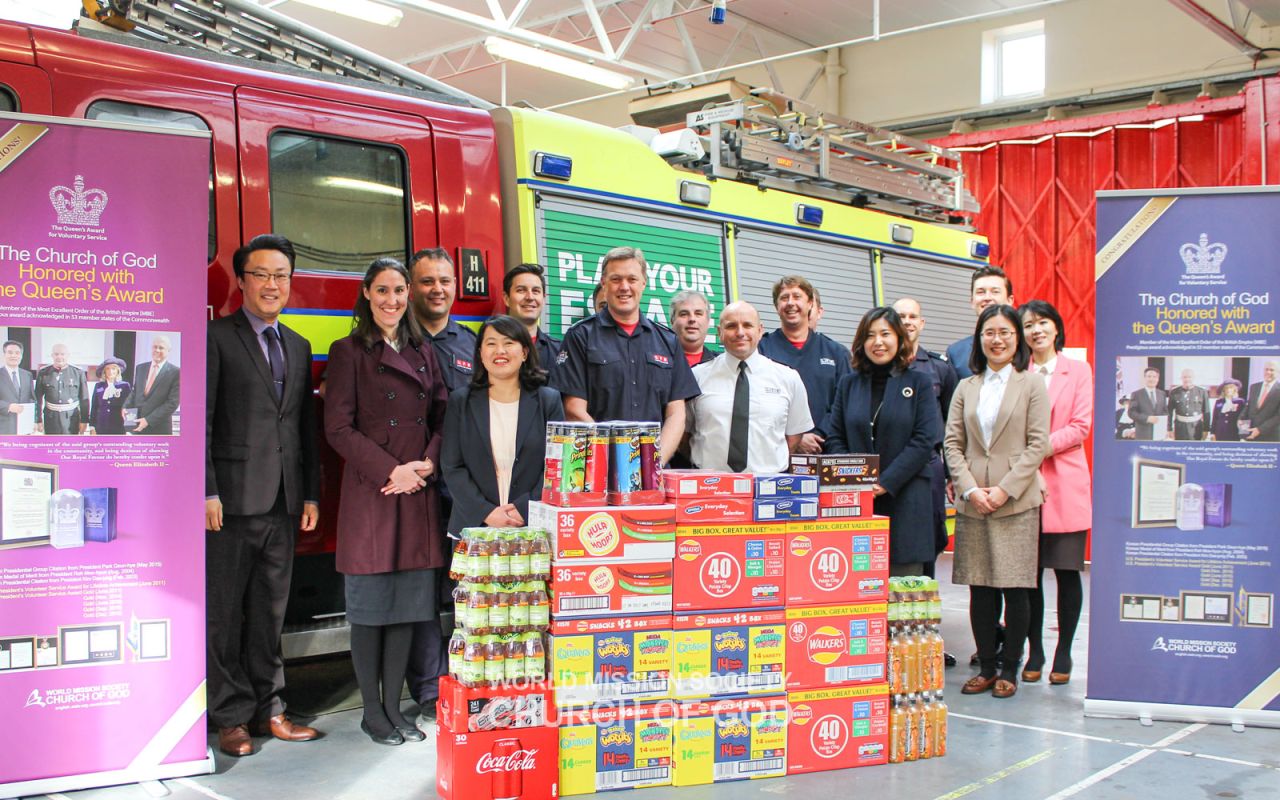 Delivering gifts to Kingston Fire Station