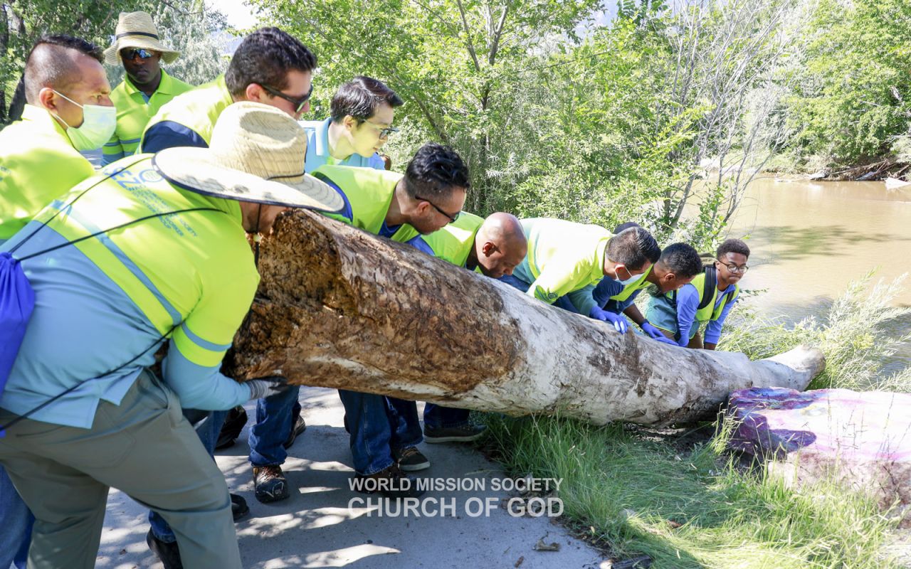 Members from Colorado Springs, CO, U.S., clean the area around America the Beautiful Park.