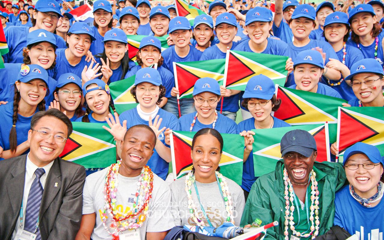 The Church of God Aura Supporters cheer for the Angola national team at the Daegu Universiade 2003.